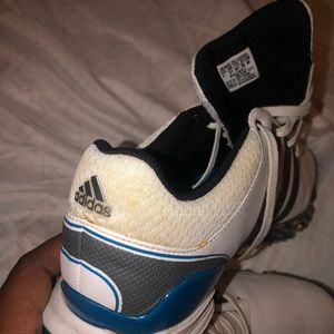Blue and white adidas golf shoes